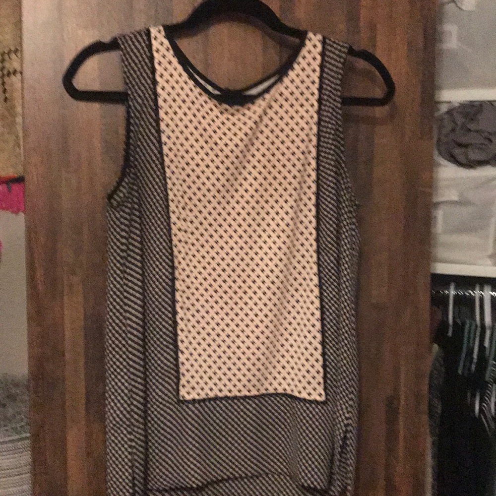 Pink and white sleeveless blouse